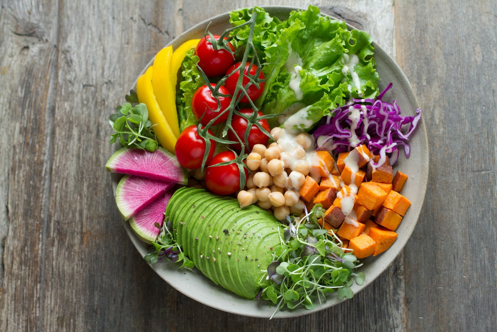 A colorful spread of vegetables, grains, legumes, and other nutrient-dense whole foods