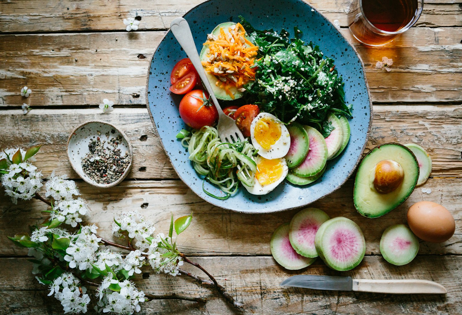 A balanced table of colorful vegetables, grains, and nourishing whole foods
